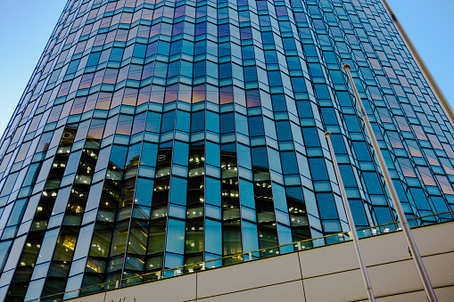 The Fuji Xerox R&D Square is a 20-story office building with enough space for 4,500 employees. The whole structure is elliptical in shape and features a glass exterior that mimics traditional Japanese folding screens that create a wonderful mixture of varying degrees of reflected light. \n\nThe jagged edges of the exterior design also helps break up the flow of air along the buildings exterior surface, which helps weaken the sudden gusts of downdrafts and vortices that hit pedestrians on the city streets below.