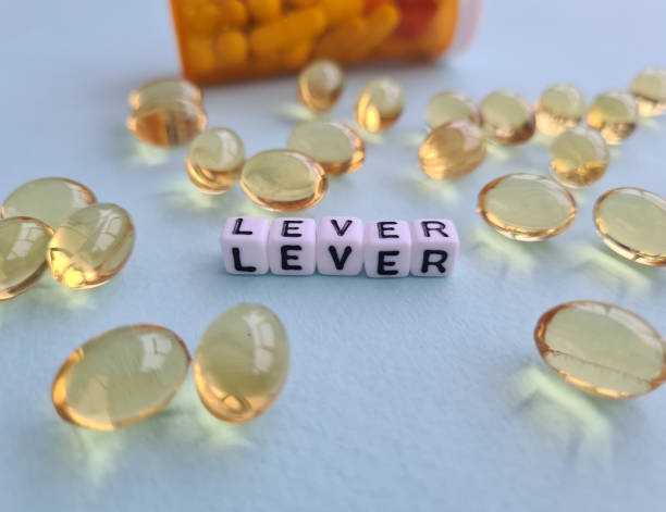 istock Liver problems with medical pills and liver closeup 1448979057