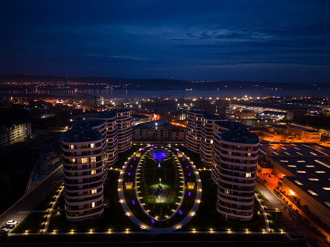 Aerial top view of modern residential complex in Varna city at night. Night urban landscape. Varna, Bulgaria