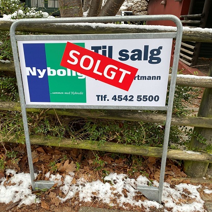 The photo was taken 12/13/2022 in Copenhagen suburb. The Real Estate sign says sold. House market prices are currently  falling rapidly