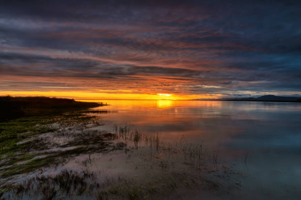 istock sunset glow view at the estuary where river meets sea 1448990604