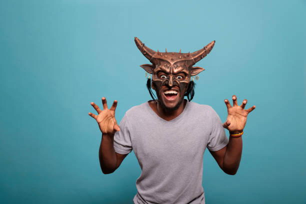 Traditional Japanese mask of a demon on white background.
