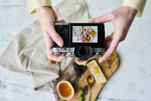 istock Photographer taking photo with camera 1448994323