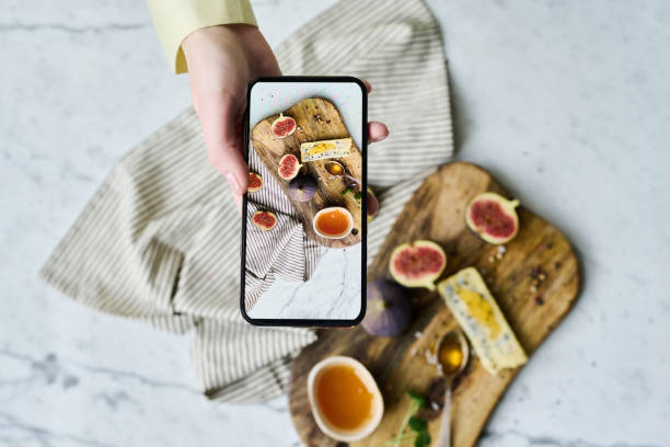 istock Photographer taking photo on smartphone 1448994366