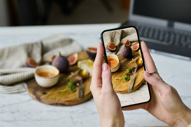 istock Woman learning to photograph still life 1448994456