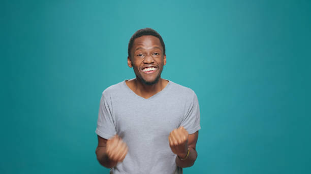 istock African american man celebrating achievement and success 1448994571
