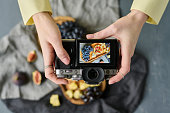 Photographer making photo of fruits