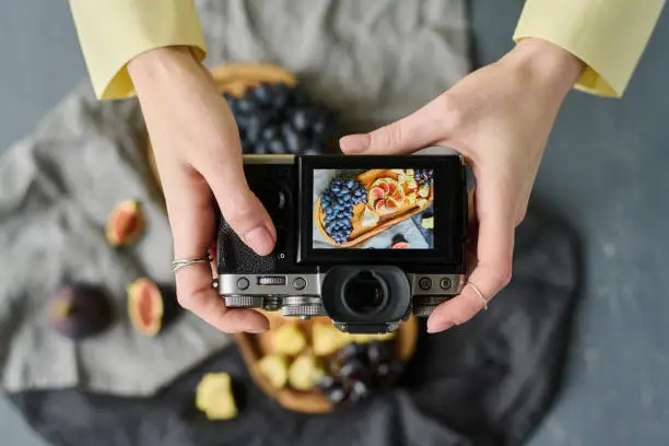 Photo of Photographer making photo of fruits