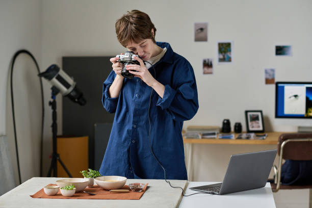 istock Photographer working in photo studio 1448994877