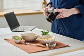 Photographer making close-up portrait of food