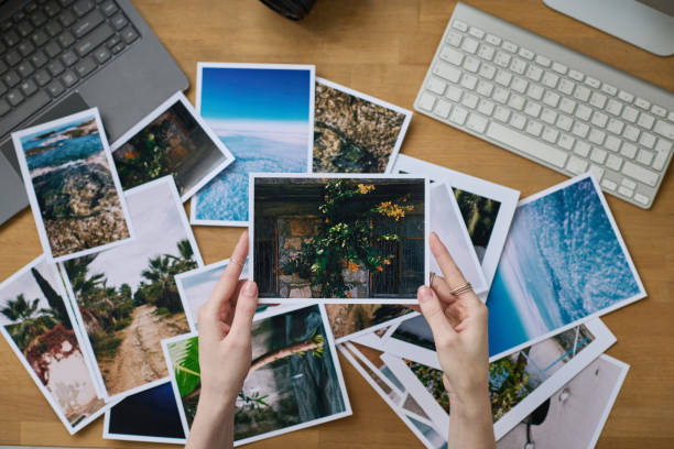 istock Photographer examining her professional photos 1448995102
