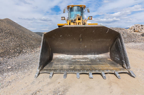 istock Excavator building a road in a site construction 1449006494