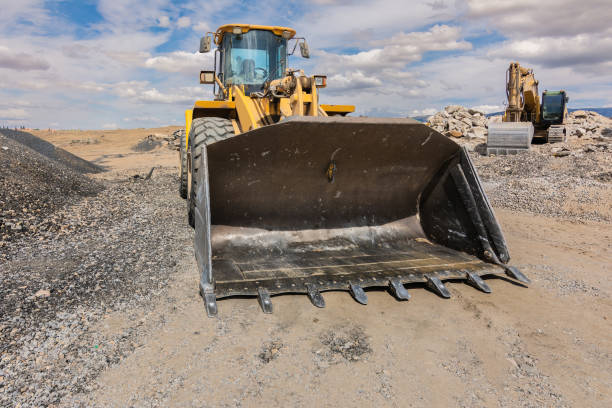 istock Excavator building a road in a site construction 1449006501