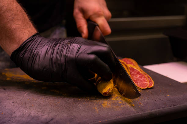 istock Close-up of a butcher with a knife. 1449006551