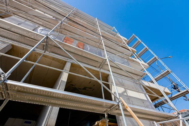 istock Shot from below on the unfinished housing edifice with scaffolding, work in progress 1449007576