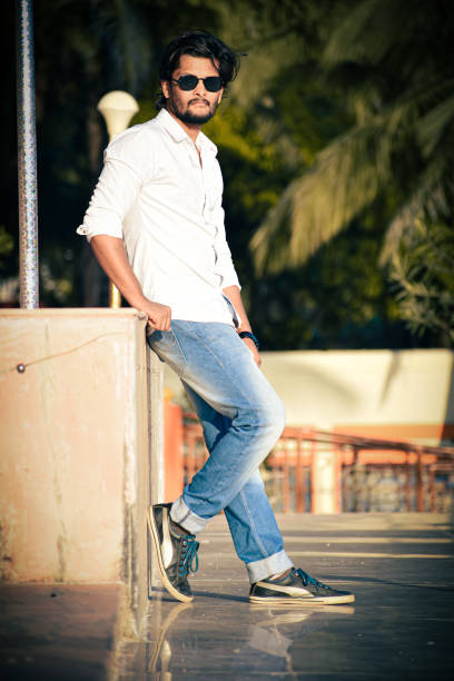 istock Stylish hipster with sunglasses posing, looking at camera. 1449008473
