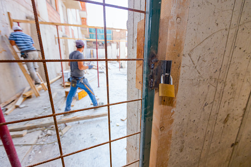 Podlock Gate Build In Locked Padlock On The Grid Gate On The Construction Site Stock Photo ...