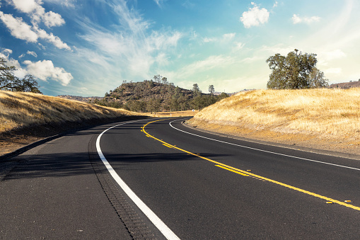 Asphalt road and country landscape