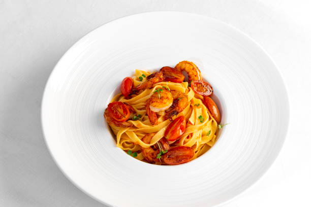 istock pasta with shrimp in a large white plate 1449012213
