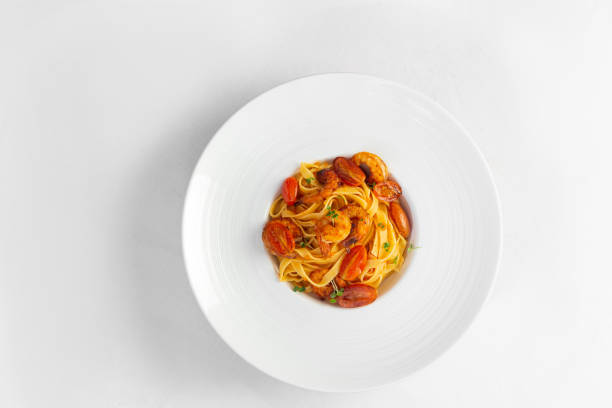 istock pasta with shrimp in a large white plate 1449012380