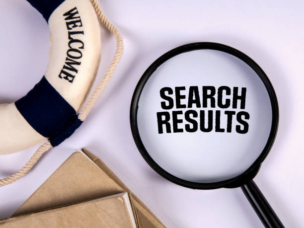 istock Search Results. Text, magnifying glass and lifebuoy on white background 1449012944
