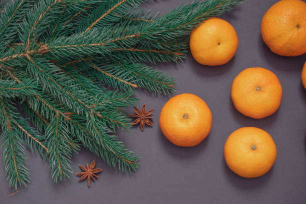 istock Christmas background with Christmas tree branches and tangerines 1449013286