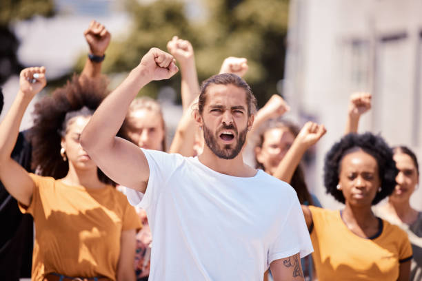 istock Angry protest leader, global peace march and support human rights, peace from war and gender equality.  Leadership, community supporting Iran and youth movement for political freedom or social change 1449013687