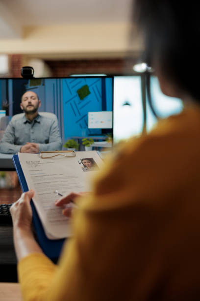 istock Businesswoman analyzing candidate cv discussing hiring cv 1449015256