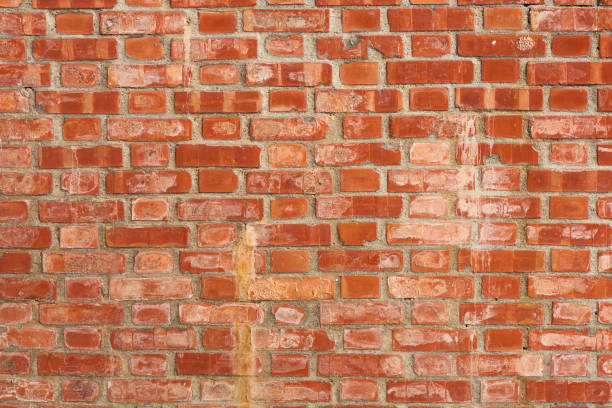 istock Weathered and Textured Brick wall grunge background. Suitable for interior design. 1449018136