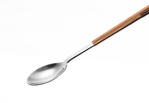 Wooden silver spoon isolated on white background.