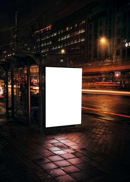 istock Night bus station with blank billboard 1449019732