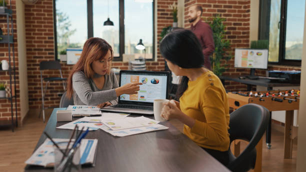 istock Team of people brainstorming strategy ideas to create presentation 1449019740
