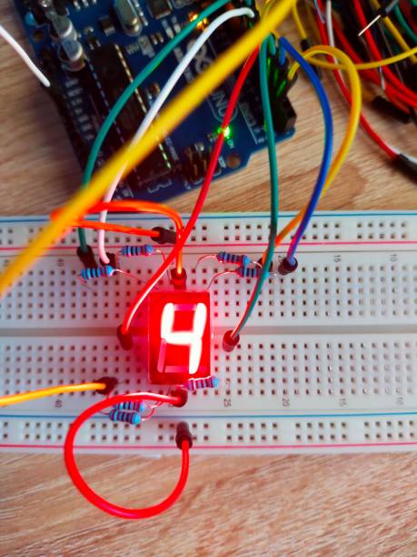 istock Vertical top view of number four on seven segment display breadboard 1449020974