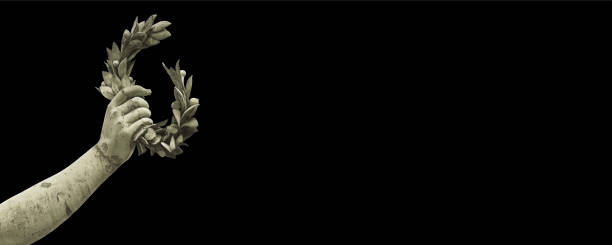 istock Hand holds a laurel wreath - old traditional bronze statue on solid color background - Success and fame web banner design concept with copy space 1449021256