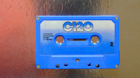 Old audio cassette tape from the seventies on grungy background,flat lay, copy space