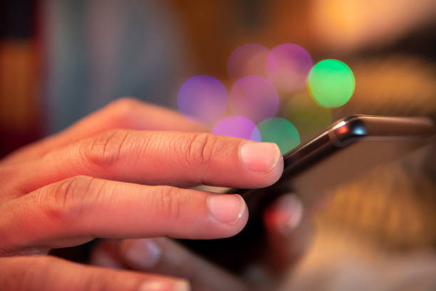 istock Close-up image of man’s hand using a smartphone. 1449030709