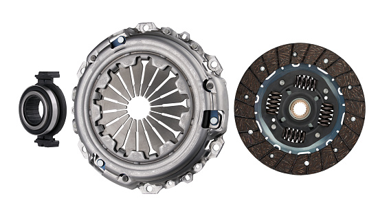 Car clutch set isolated on white background. Clutch disc and basket with release bearing.