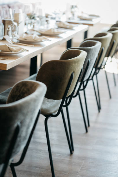 modern chairs with rustic table and decoration at a wedding