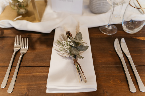 Detail shot of a wedding day place setting with name.