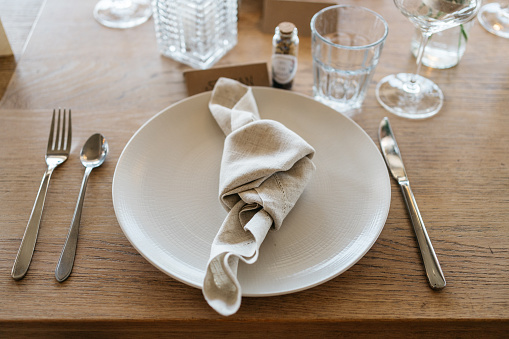 rustic table decoration with knotted cloth napkin for wedding dinner