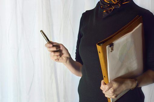 Image for Buisiness with Woman Holding Files/Studio Shot