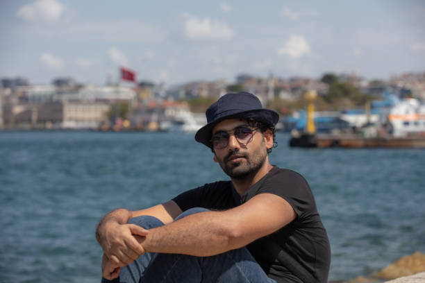Young tourist man is traveling to Istanbul.Istanbul is the largest city in Turkey, serving as the country's economic, cultural, touristic and historic hub.