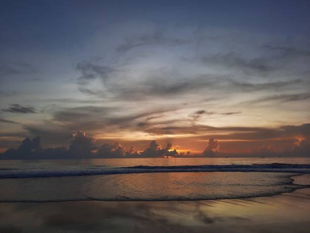 istock Sunset sea landscape. Beautiful beach scenery with calm waves 1449042126