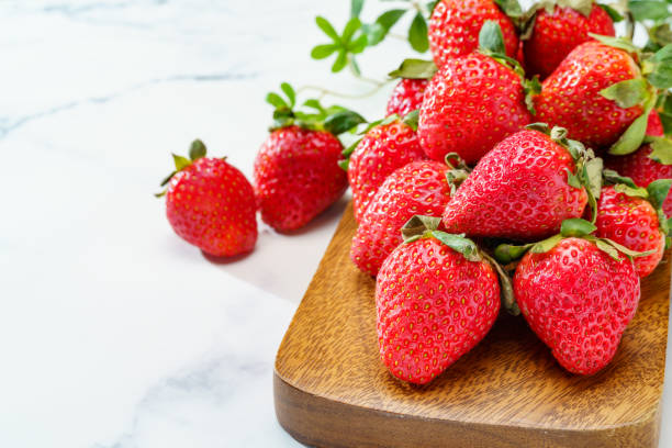 istock Fresh strawberry fruits on marble background 1449045195