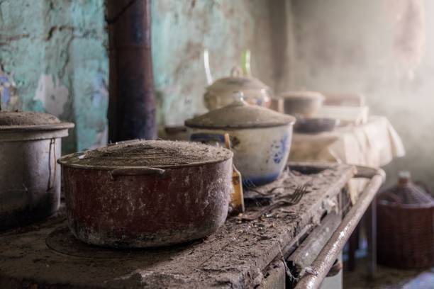 istock Ancient stove with dust covered pots in an old dirty kitchen 1449045970