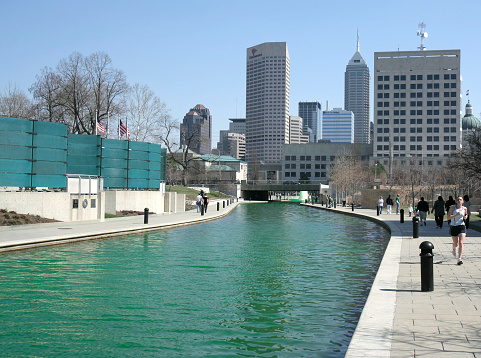Indianapolis, Indiana, USA-March 17,2009:Green Dyed Canal and Downtown Buildings at St. Patrick's Day