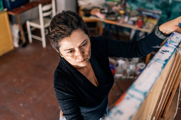 istock Middle Aged Artist Painting 1449046999