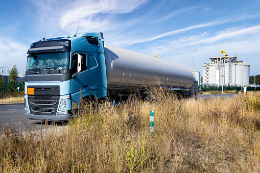 Gas tanker truck stands in front liquid natural gas storage station, Swinoujscie, Poland