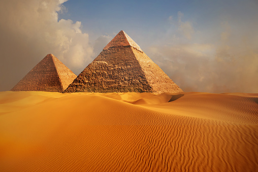 View of the Great Pyramids of Giza, in the foreground a traditionally decorated camel