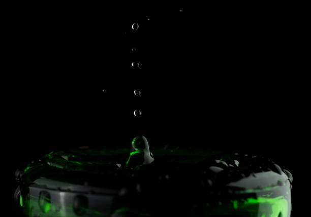 Slow Motion water droplets crashing into objects creating unique splashes explosions textures and patterns